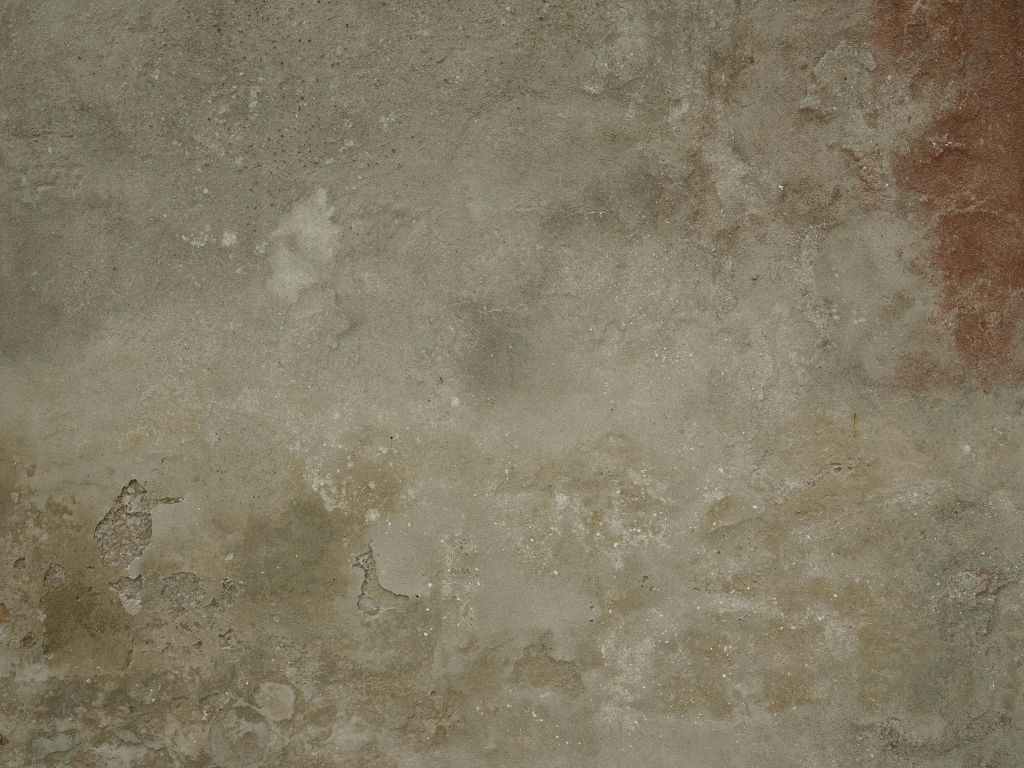 Vecchio muro con stucco rovinato dalle intemperie