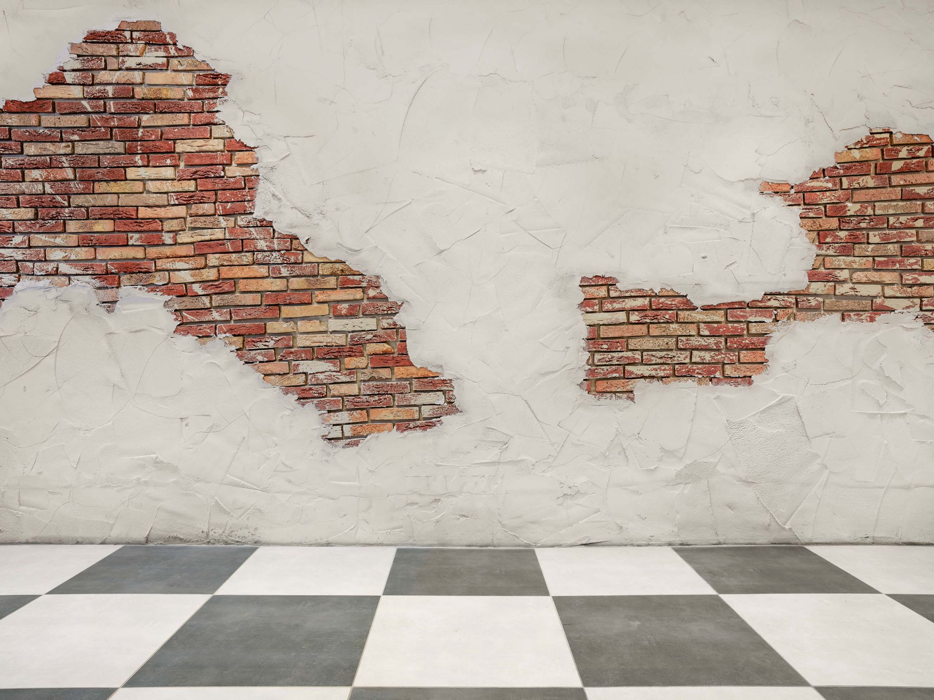 Muro di mattoni con stucco